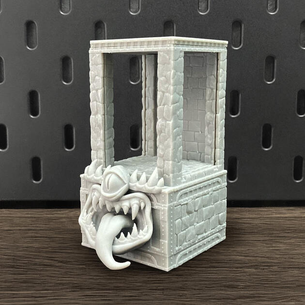The Mimic | Wall-Mounted TTRPG Organizer & Dice Drawer Hand-painted stone texture Mimic dice box with open storage drawer, mounted on an IKEA SKÅDIS pegboard as a TTRPG miniature display.