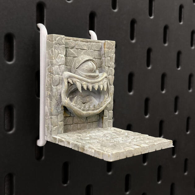 The Mimic | Wall-Mounted TTRPG Organizer & Dice Drawer Hand-painted stone texture Mimic dice box, mounted on an IKEA SKÅDIS pegboard as a TTRPG miniature display.