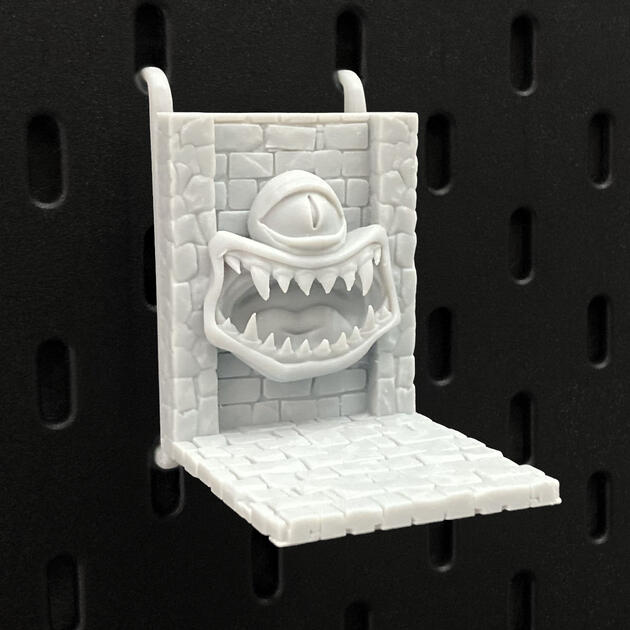 The Mimic | Wall-Mounted TTRPG Organizer & Dice Drawer Hand-painted stone texture Mimic dice box, mounted on an IKEA SKÅDIS pegboard as a TTRPG miniature display.